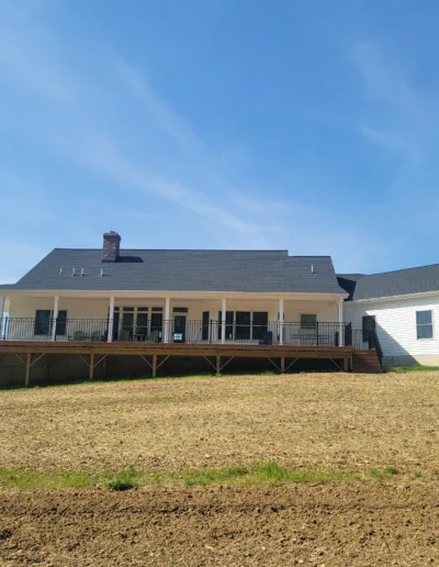 A white house on a field.