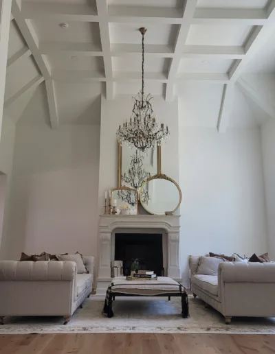 A living room with hardwood floors and a fireplace.