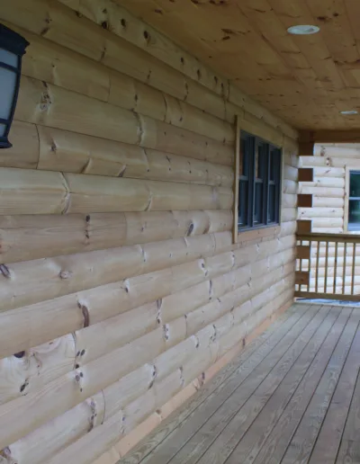 A wooden railing on the porch.
