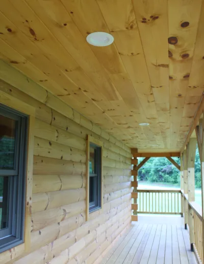 A wooden floor on the porch.