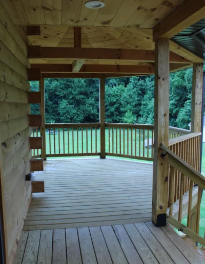 A wooden deck with a railing.