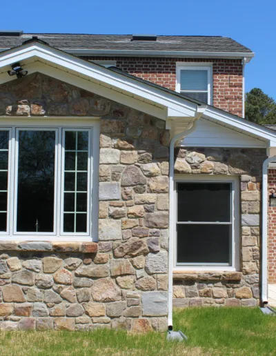 A brick house with a window.